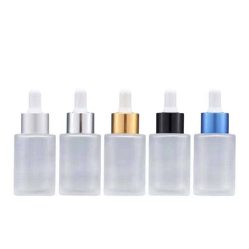 New Design Cosmetic Flat Shoulder 20ml 30ml Clear Glass Dropper Bottle With Silver Gold Honeycomb Ring Cap Dropper